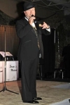 Grant singing at the Bow Wow Boogie USO Variety Show June 6, 2009